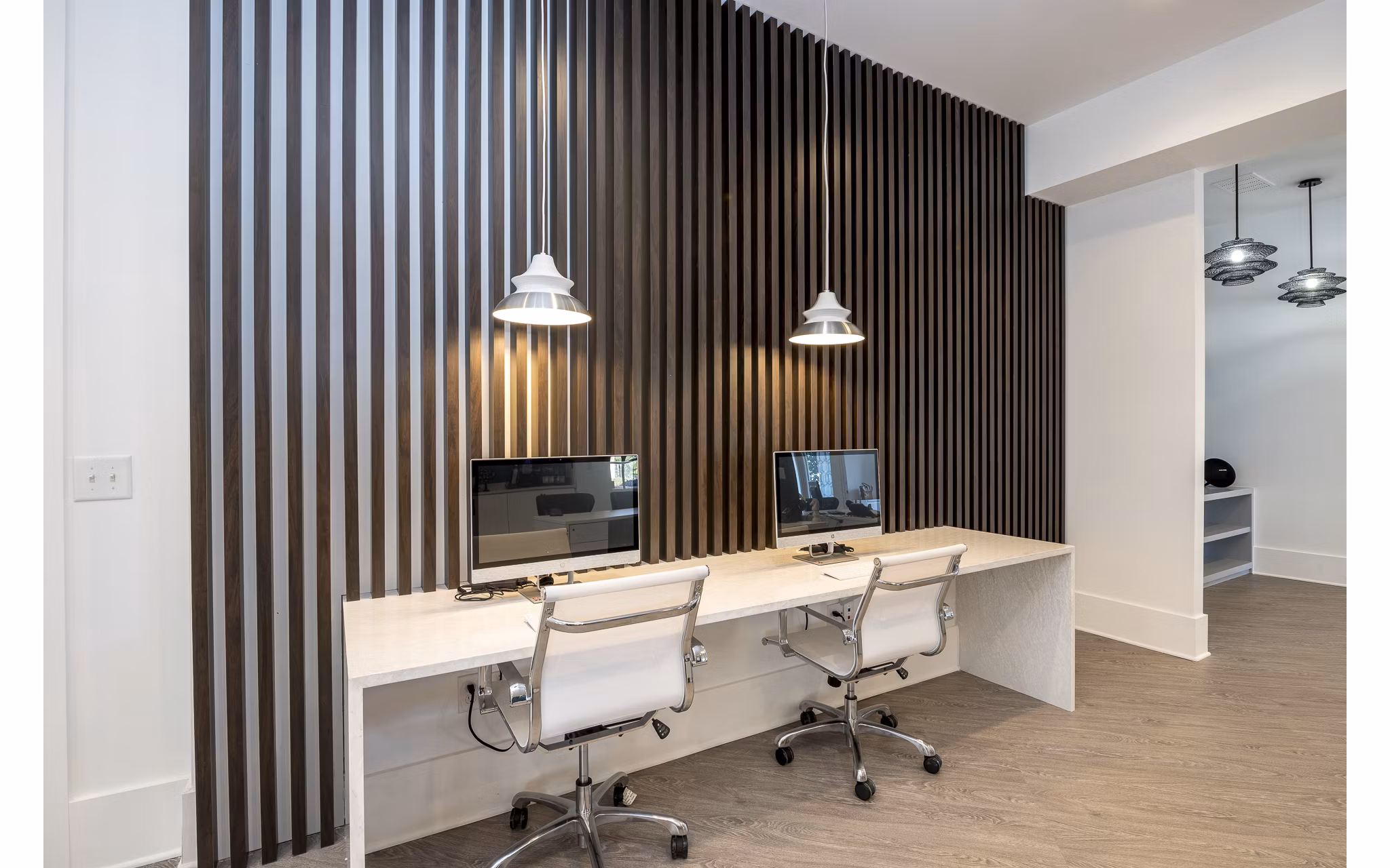 Modern business center with ergonomic workstations at Avana City North Apartments for luxury living