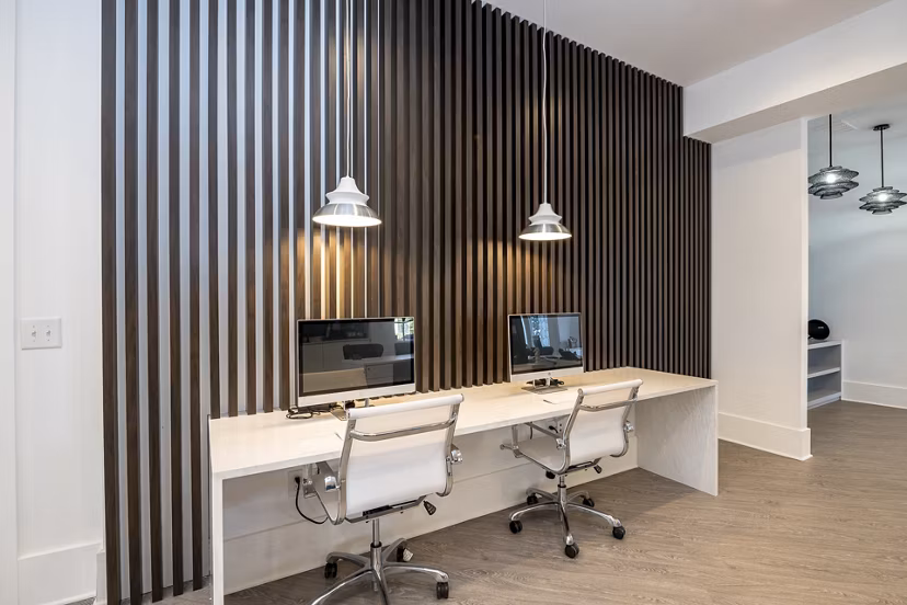 Modern business center with ergonomic workstations at Avana City North Apartments for luxury living