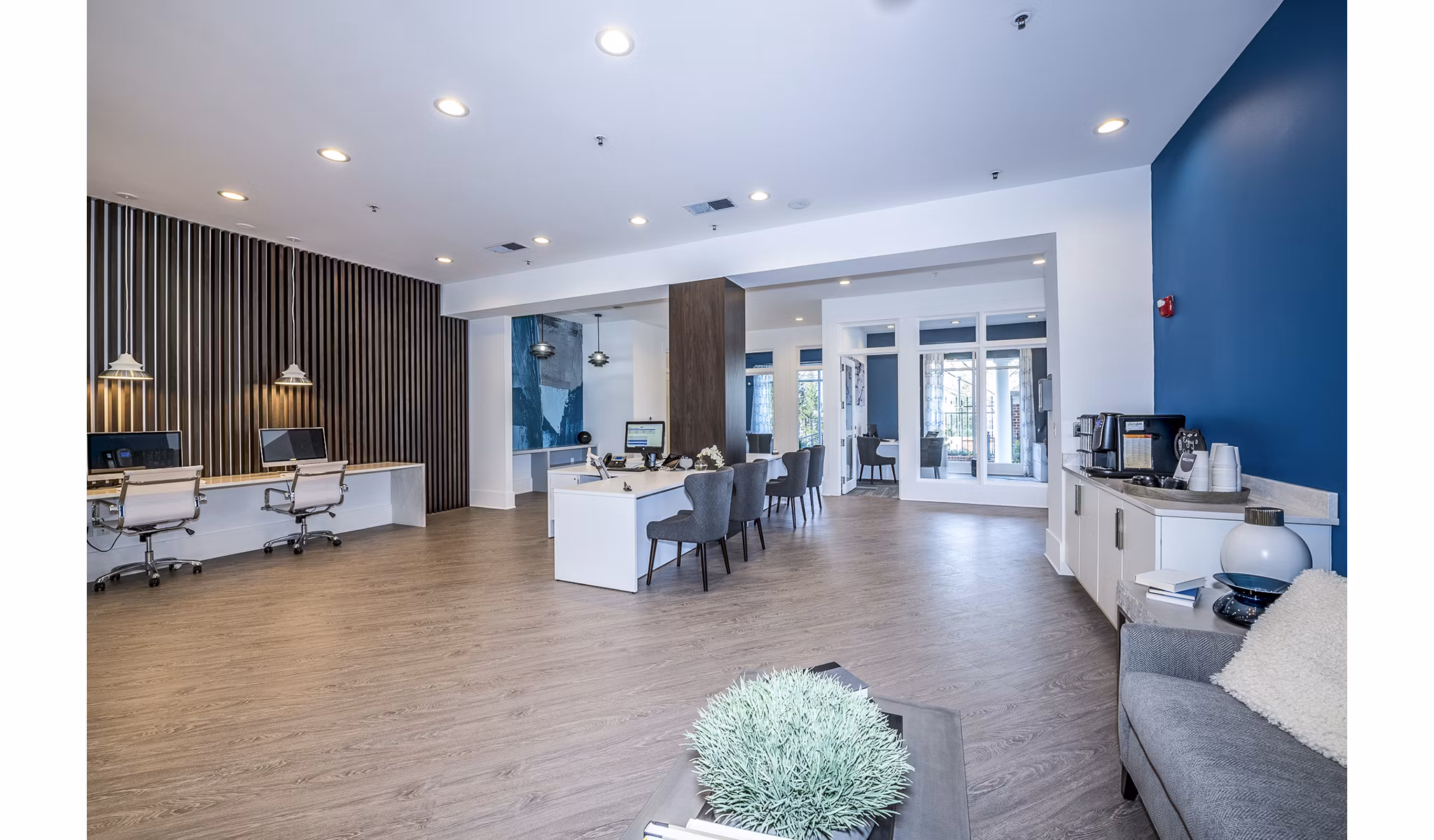 Leasing office with modern decor at Avana City North Apartments clubhouse