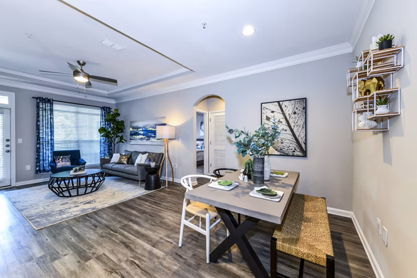 Dining room featuring contemporary furnishings and elegant lighting in Avana City North Apartments