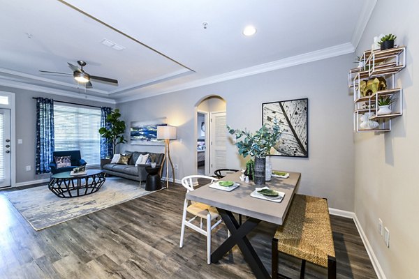 Dining room featuring contemporary furnishings and elegant lighting in Avana City North Apartments
