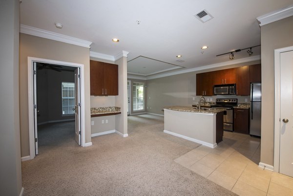 Dining room with modern decor and elegant lighting at Avana City North Apartments
