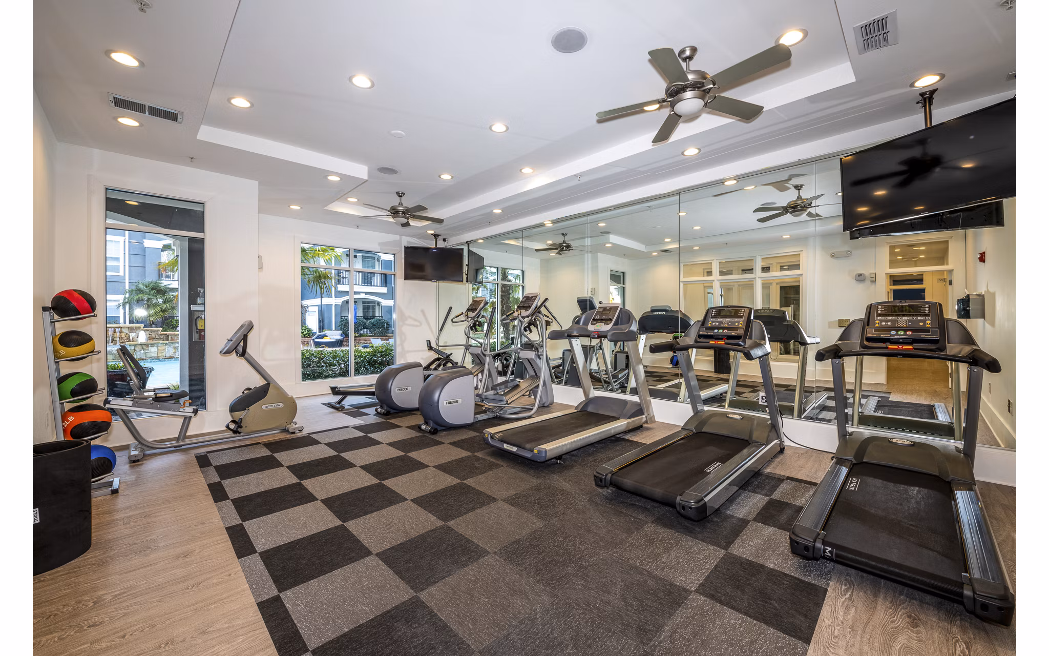 Modern fitness center with state-of-the-art equipment at Avana City North Apartments