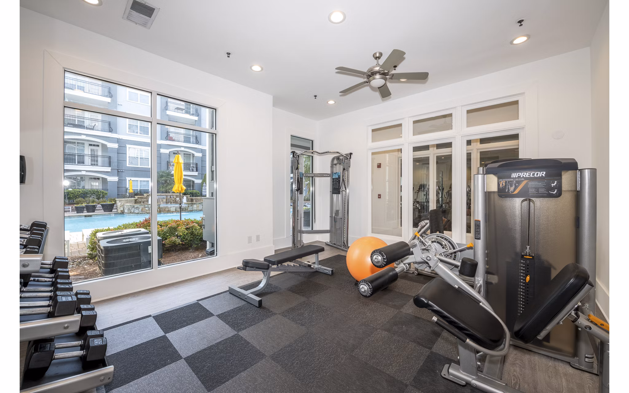 Fully-equipped fitness center with modern machines at Avana City North Apartments