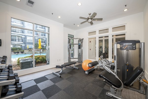 Fully-equipped fitness center with modern machines at Avana City North Apartments