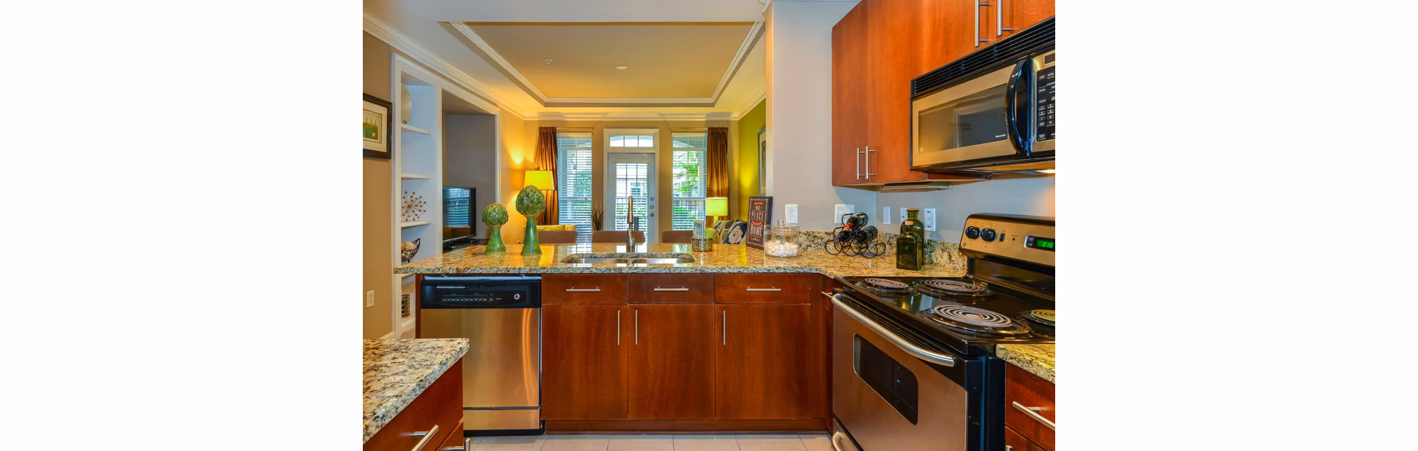 Modern kitchen with stainless steel appliances at Avana City North Apartments