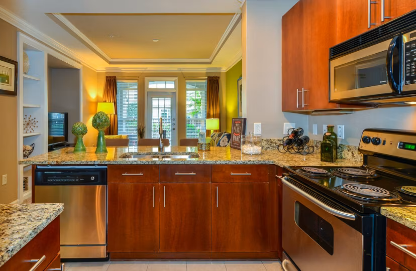 Modern kitchen with stainless steel appliances at Avana City North Apartments
