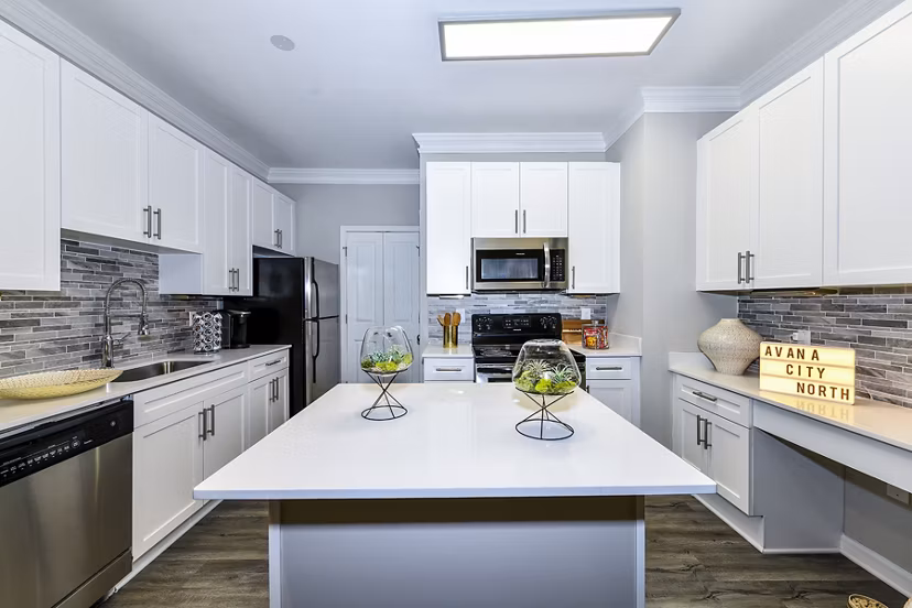 Modern kitchen with stainless steel appliances at Avana City North Apartments, ideal for culinary enthusiasts