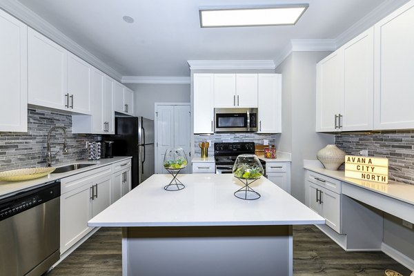 Modern kitchen with stainless steel appliances at Avana City North Apartments, ideal for culinary enthusiasts