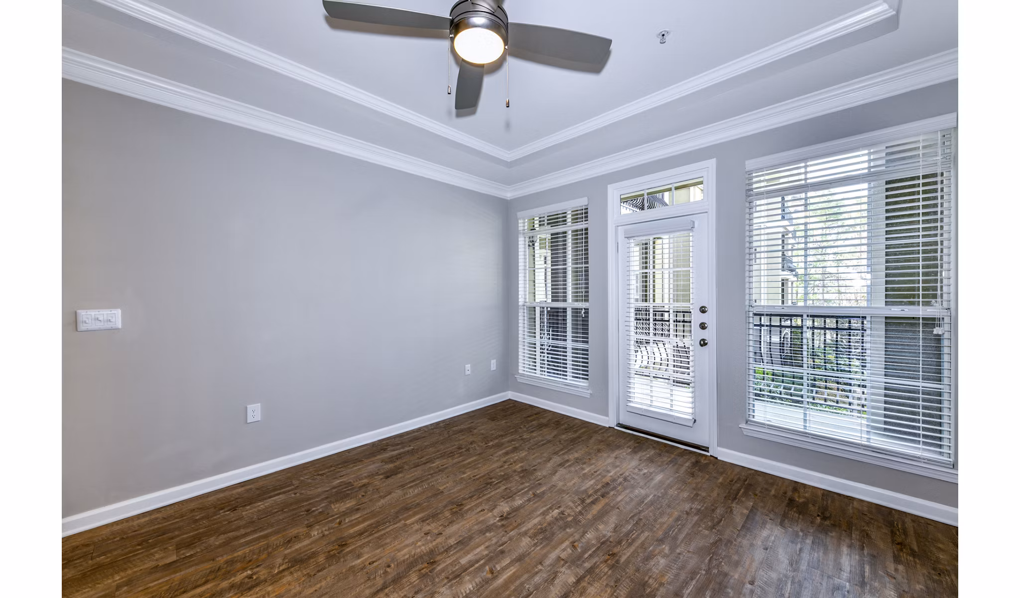 Spacious living room with modern decor at Avana City North Apartments in a luxury setting