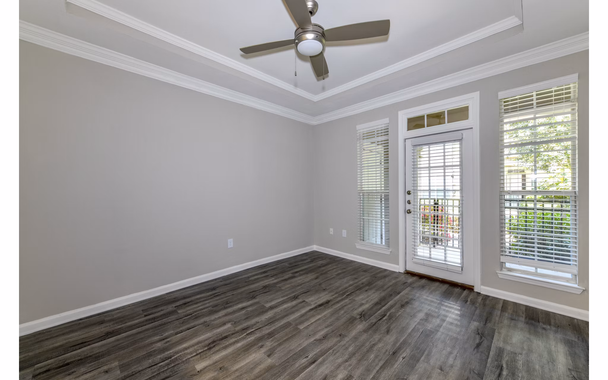 Spacious living room with modern decor at Avana City North Apartments
