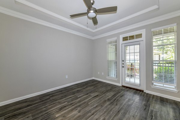 Spacious living room with modern decor at Avana City North Apartments