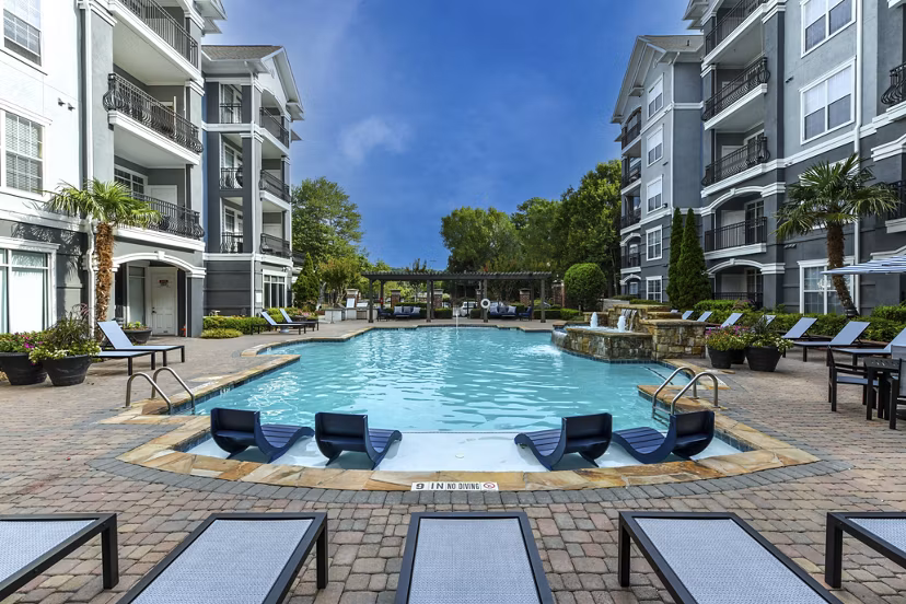 Resort-style pool area at Avana City North Apartments offering luxury relaxation