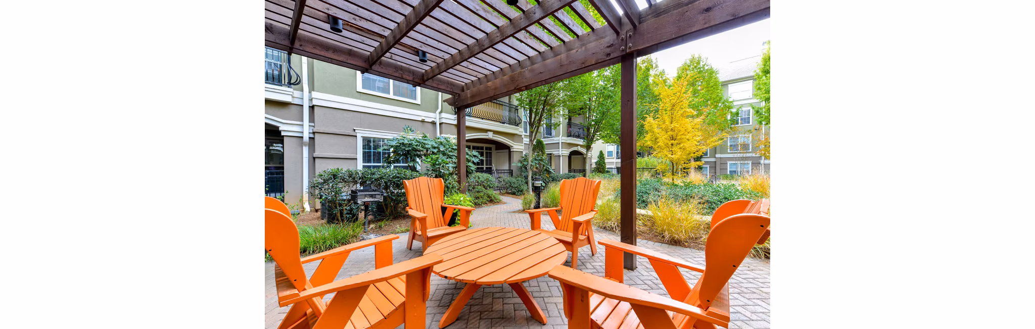 Chic patio area with cozy seating at Avana City North Apartments, perfect for outdoor relaxation and social gatherings