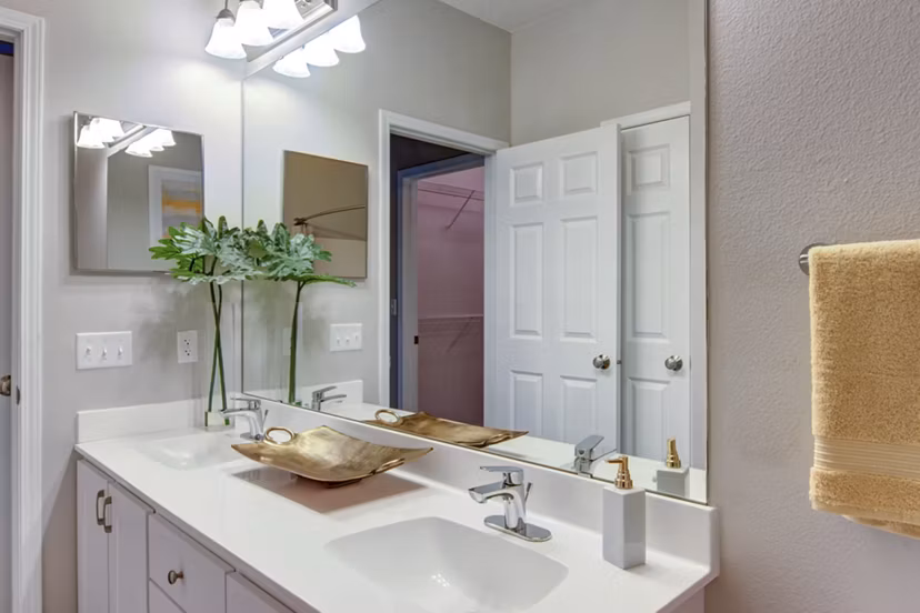 Luxurious bathroom with modern fixtures at The Grand Reserve Apartments