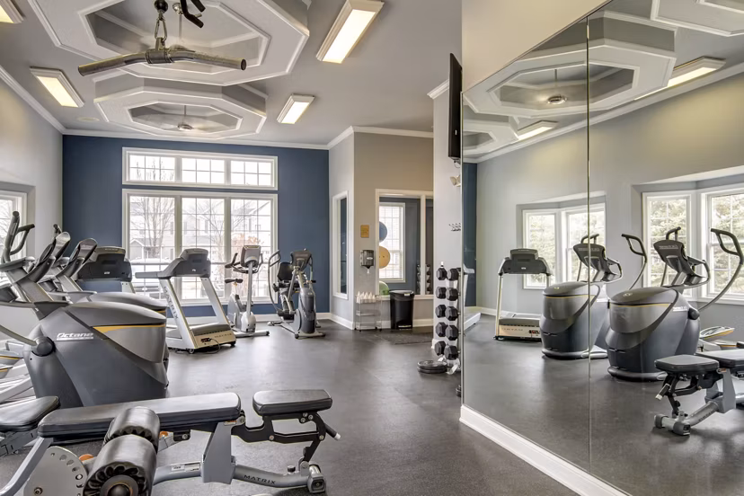 Modern fitness center with state-of-the-art equipment at The Grand Reserve Apartments