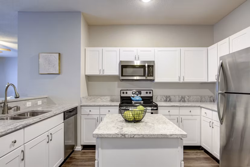 Spacious kitchen with modern appliances in The Grand Reserve Apartments