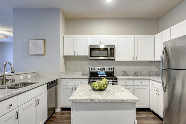 Spacious kitchen with modern appliances in The Grand Reserve Apartments