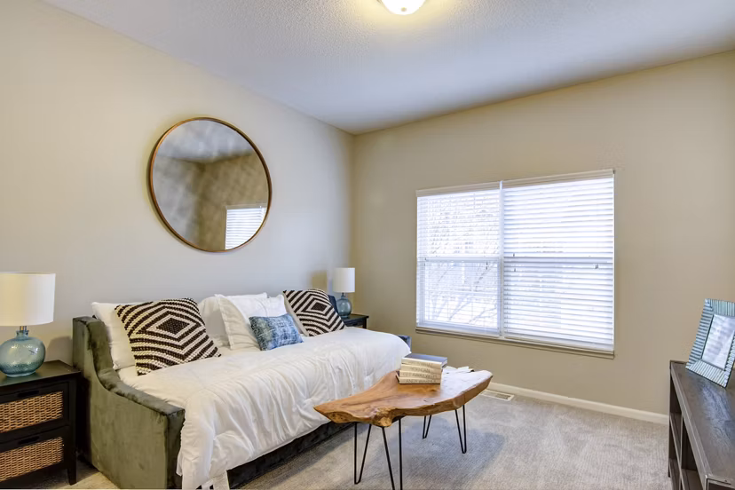 Spacious living room with contemporary furnishings in The Grand Reserve Apartments