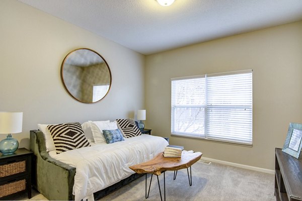 Spacious living room with contemporary furnishings in The Grand Reserve Apartments