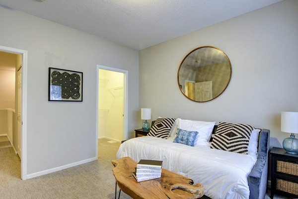 Modern living room with elegant decor and plush seating in The Grand Reserve Apartments
