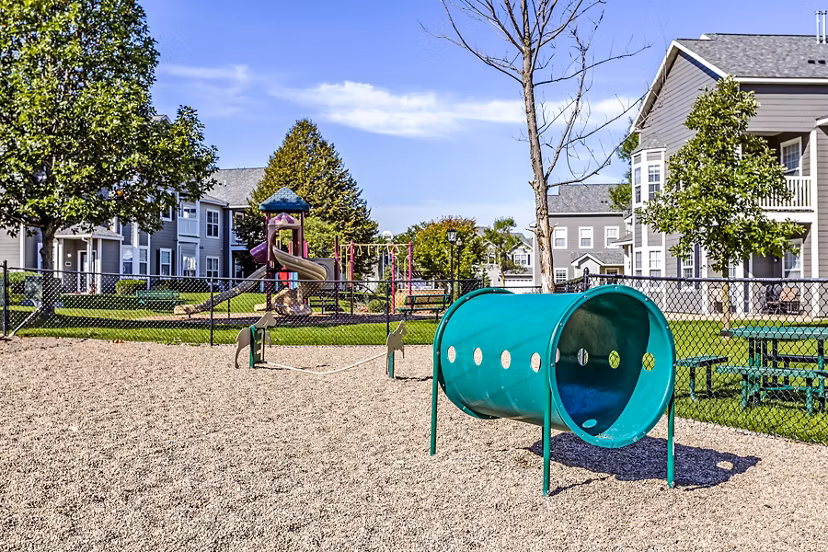 Spacious playground with modern equipment at The Grand Reserve Apartments