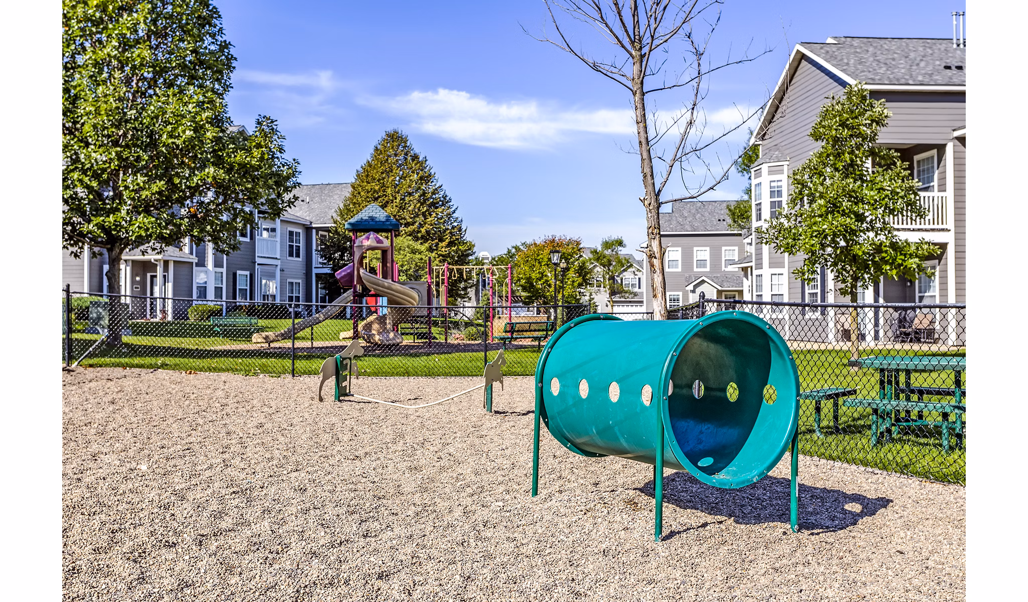 Spacious playground with modern equipment at The Grand Reserve Apartments