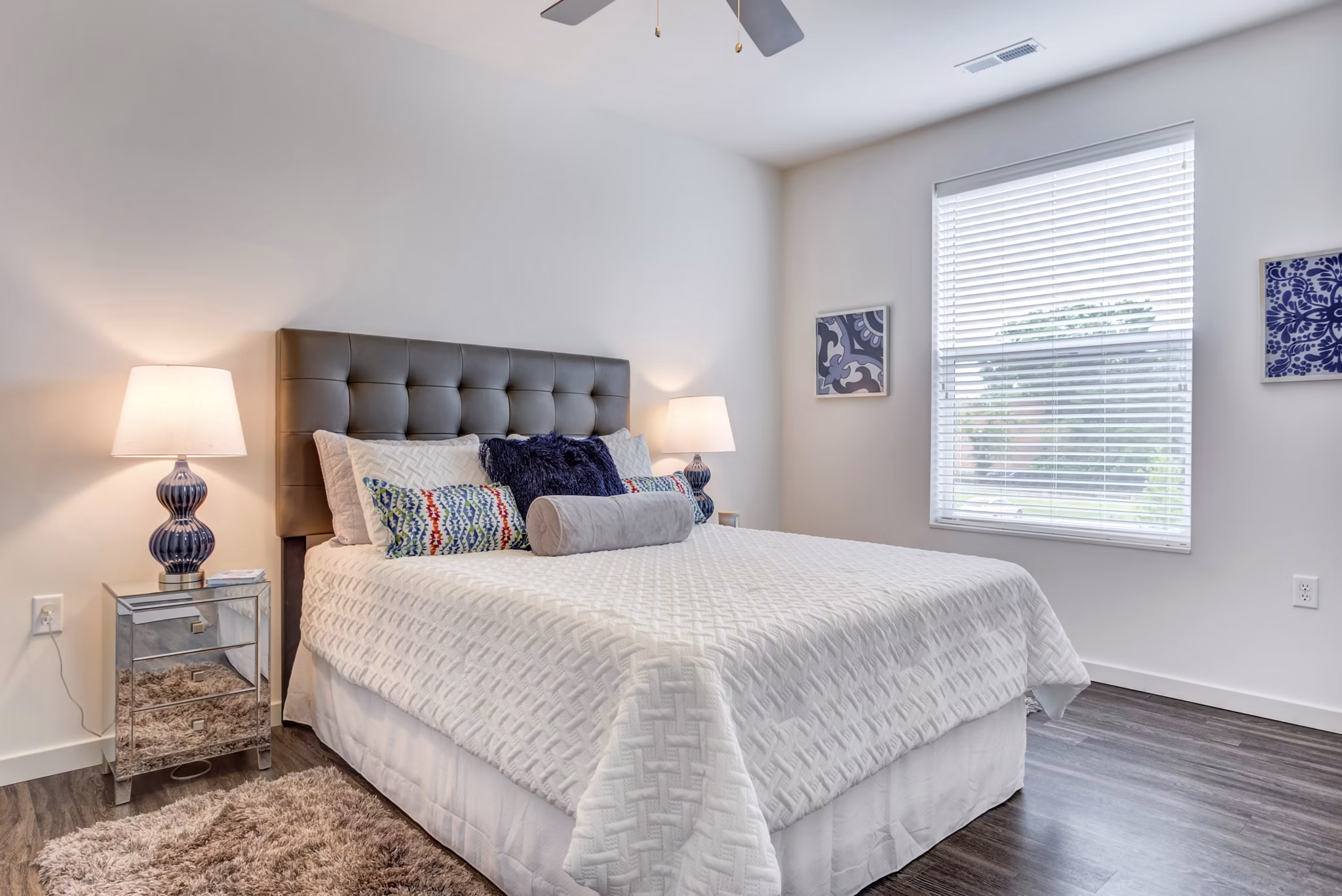 Cozy bedroom with modern decor at Sunnen Station Apartments