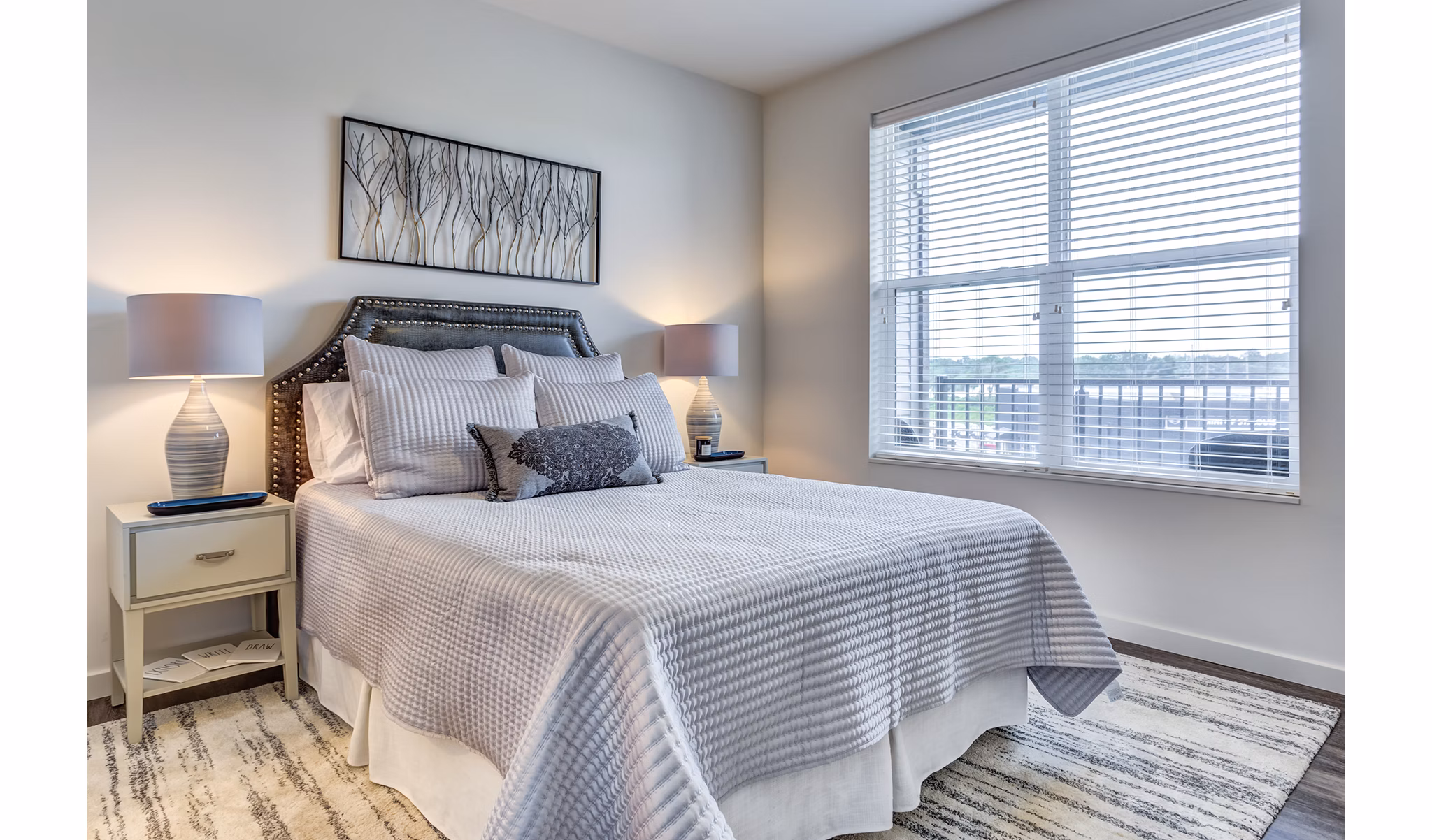 Inviting bedroom with modern decor in Sunnen Station Apartments