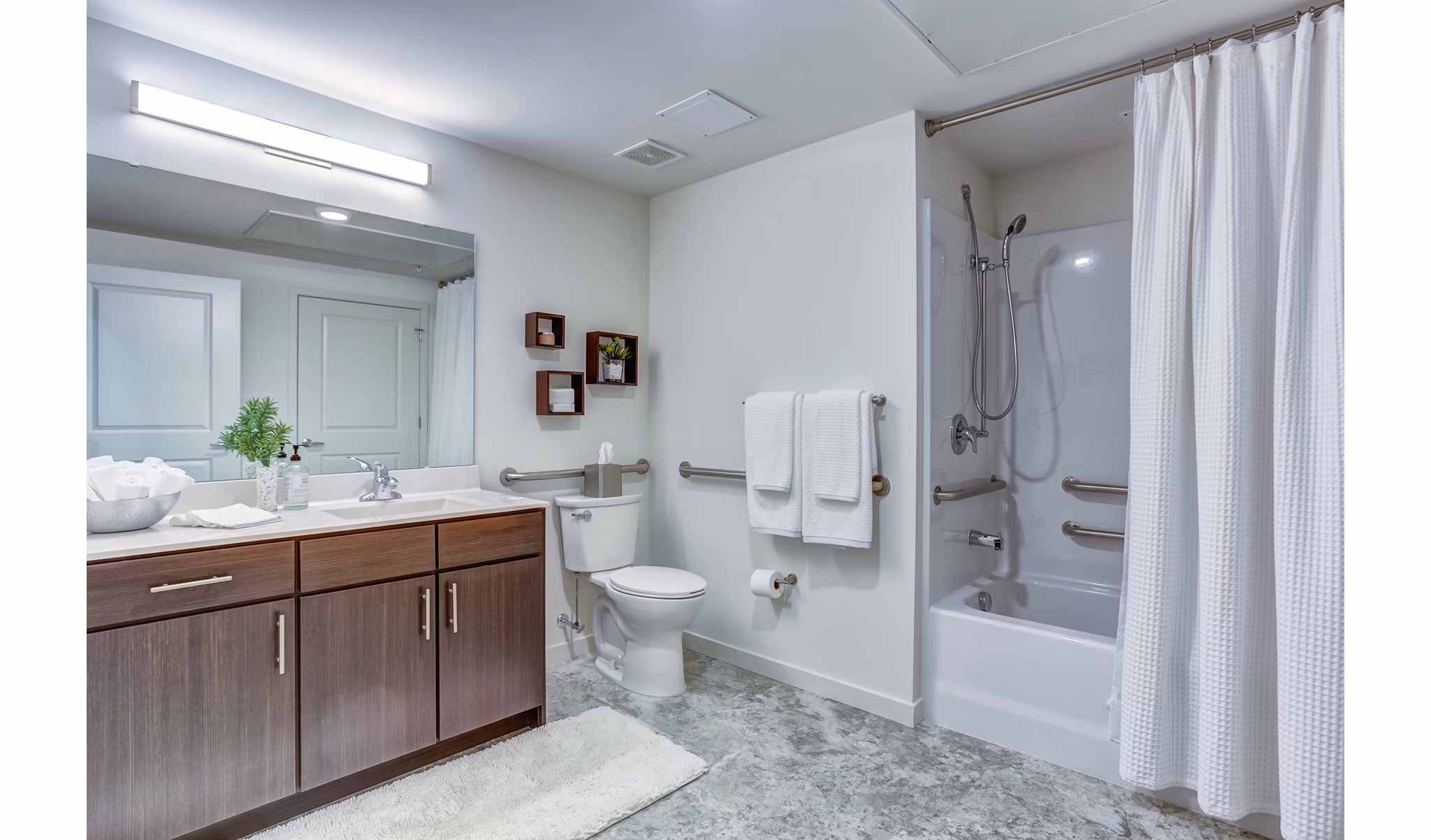 Bathroom featuring modern fixtures and elegant tilework at Sunnen Station Apartments