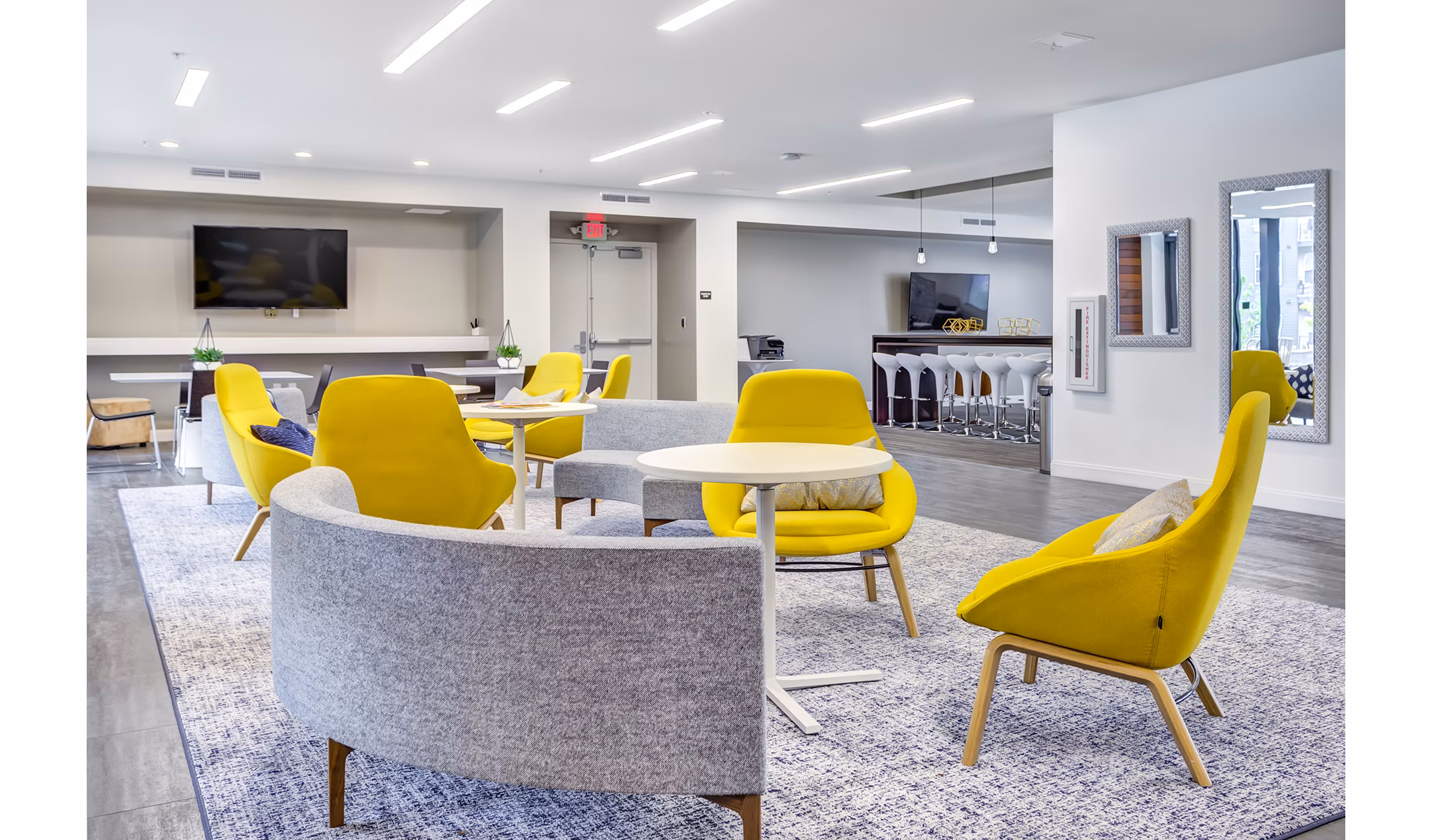 Modern clubhouse with stylish seating at Sunnen Station Apartments