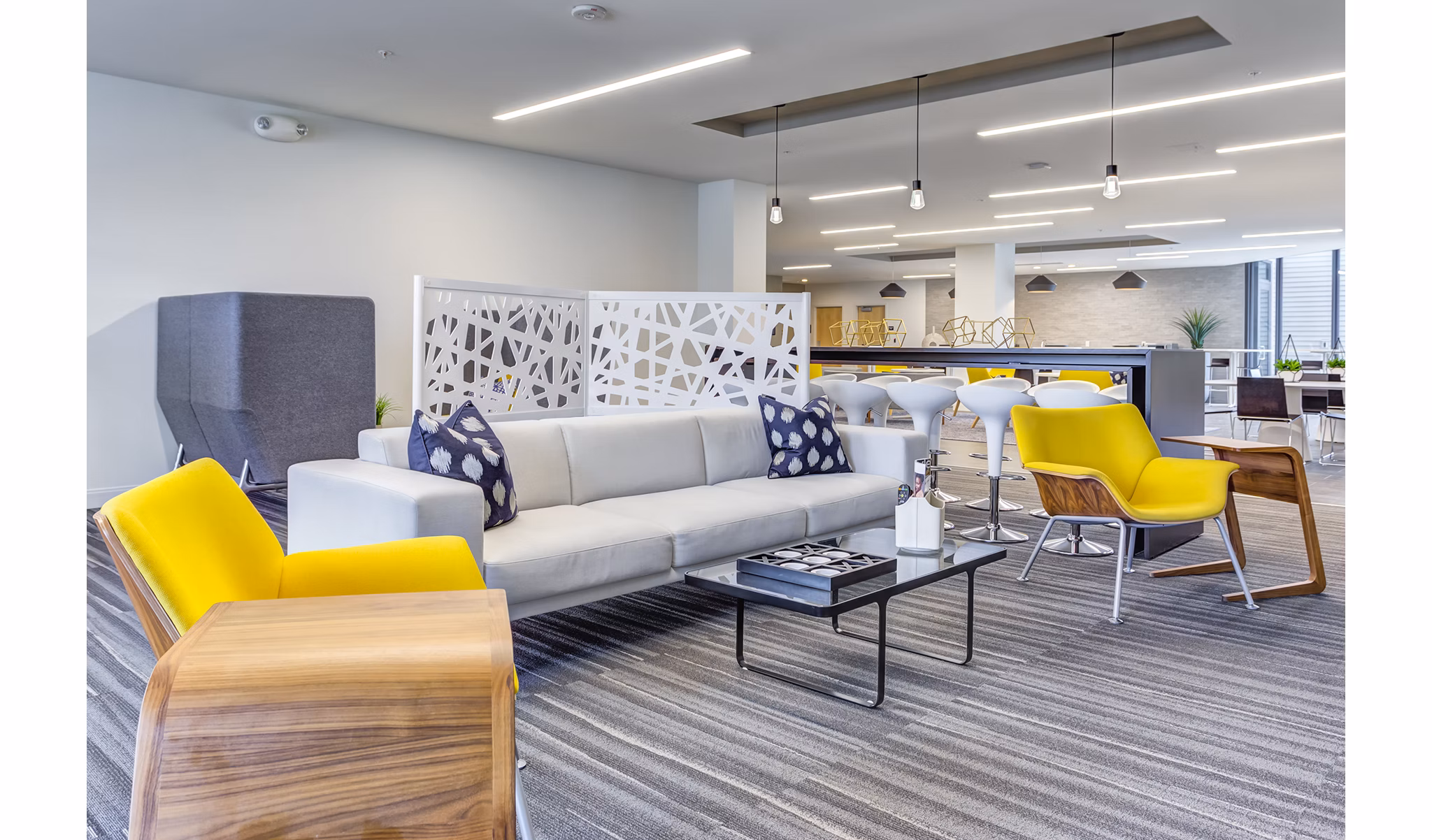 Elegant clubhouse with modern decor at Sunnen Station Apartments, ideal for social gatherings and events in a vibrant community setting