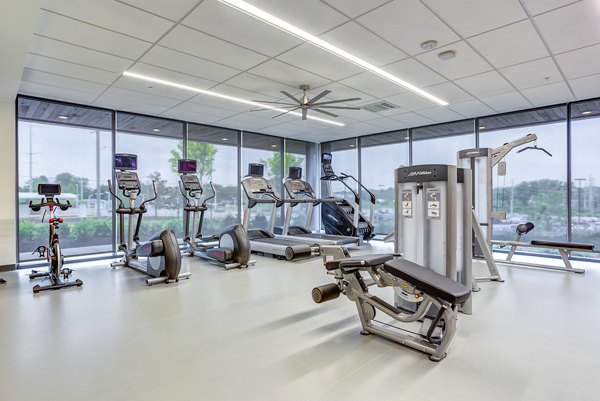 State-of-the-art fitness center with modern equipment at Sunnen Station Apartments, perfect for active lifestyles and workouts