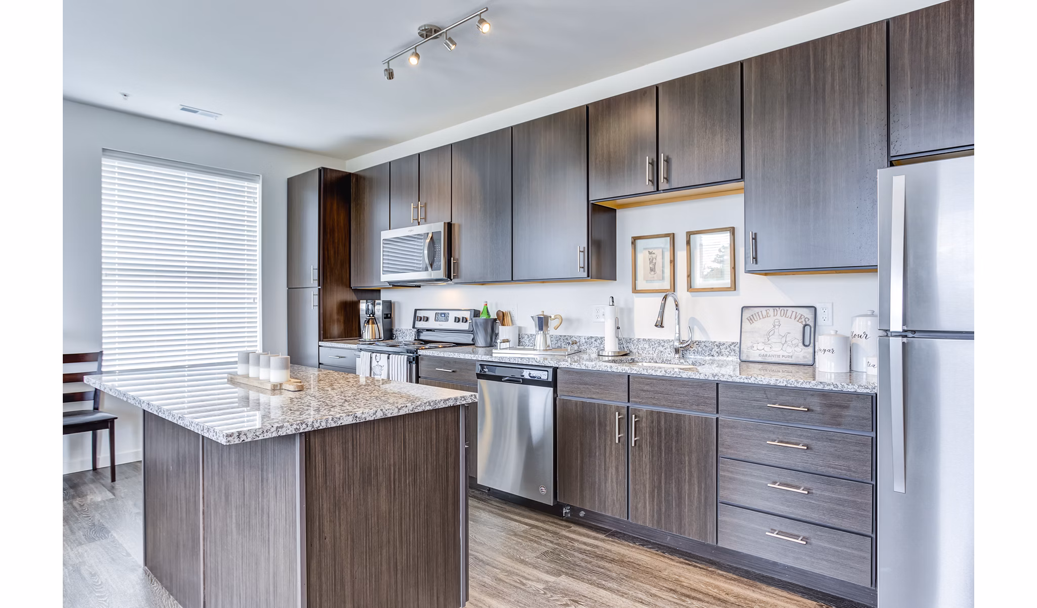Stylish kitchen with modern appliances at Sunnen Station Apartments