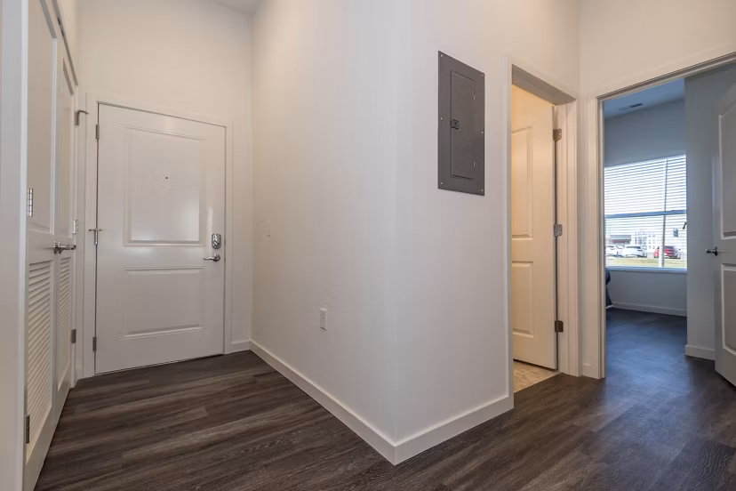 Spacious living room with modern furnishings in Sunnen Station Apartments