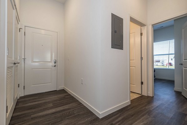 Spacious living room with modern furnishings in Sunnen Station Apartments