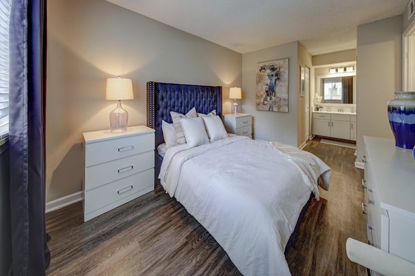 Elegant bedroom with modern decor and large windows at La Morada at Weston Apartments