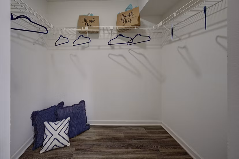 Walk-in closet with custom shelving in La Morada at Weston Apartments