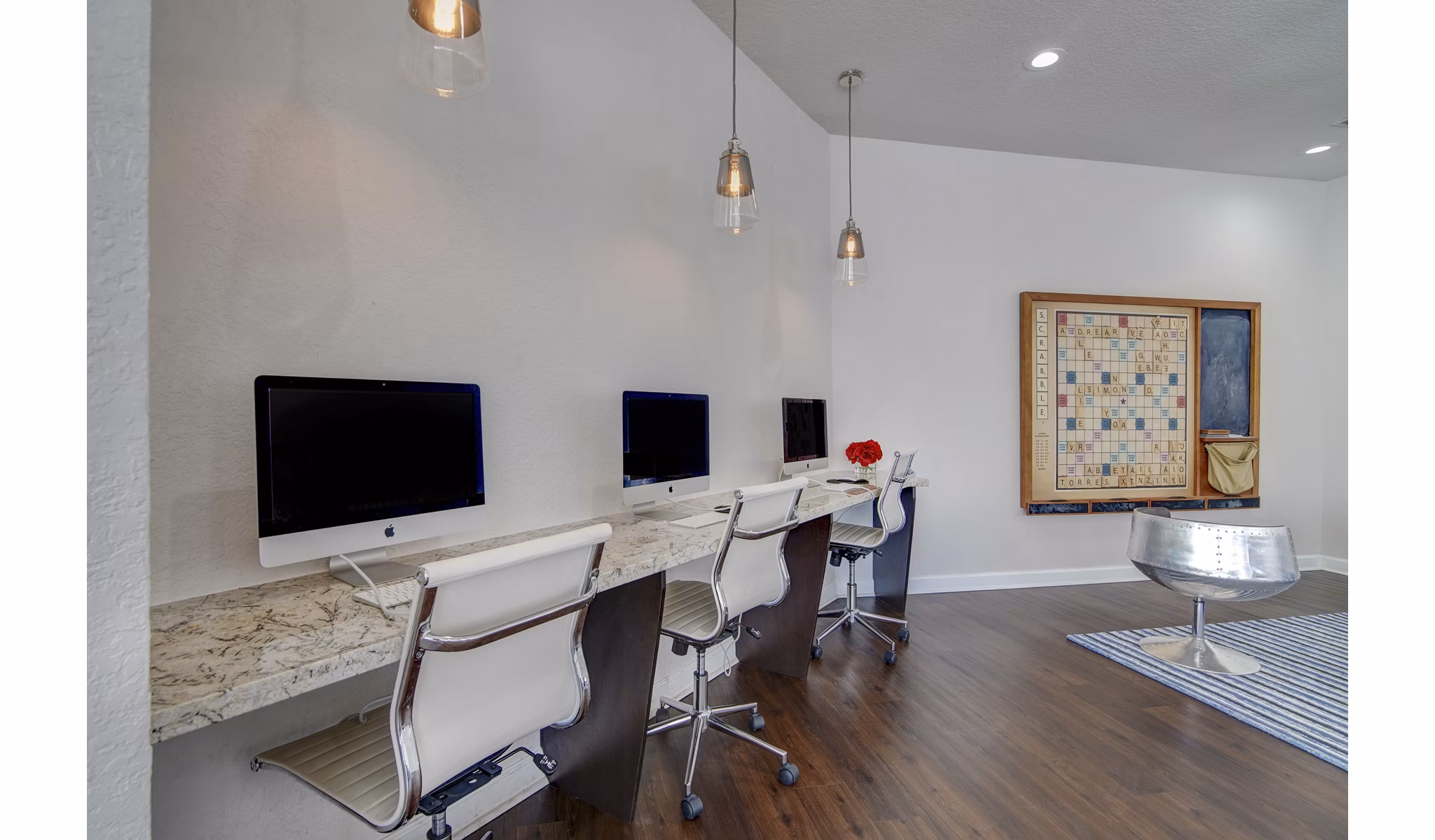 La Morada at Weston: Modern business center with sleek workstations and high-speed internet access in luxury apartments