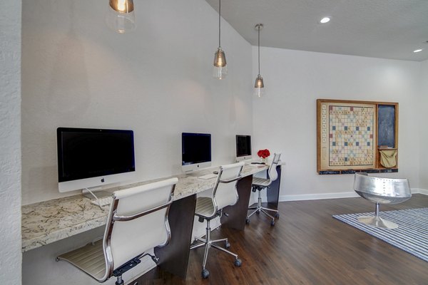 La Morada at Weston: Modern business center with sleek workstations and high-speed internet access in luxury apartments
