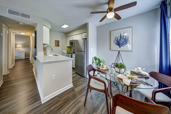 Dining area with modern decor at La Morada at Weston Apartments featuring elegant lighting and sleek furnishings