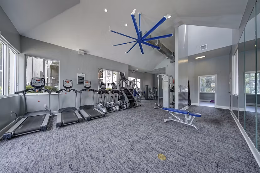 La Morada at Weston: Modern fitness center with cardio machines and free weights, ideal for maintaining a healthy lifestyle