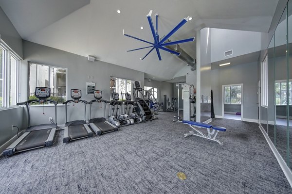 La Morada at Weston: Modern fitness center with cardio machines and free weights, ideal for maintaining a healthy lifestyle