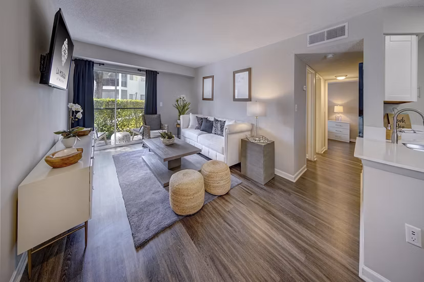 Spacious living room with modern decor in La Morada at Weston Apartments