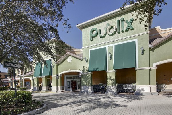 La Morada at Weston Apartments: Scenic neighborhood views with walking paths and lush greenery
