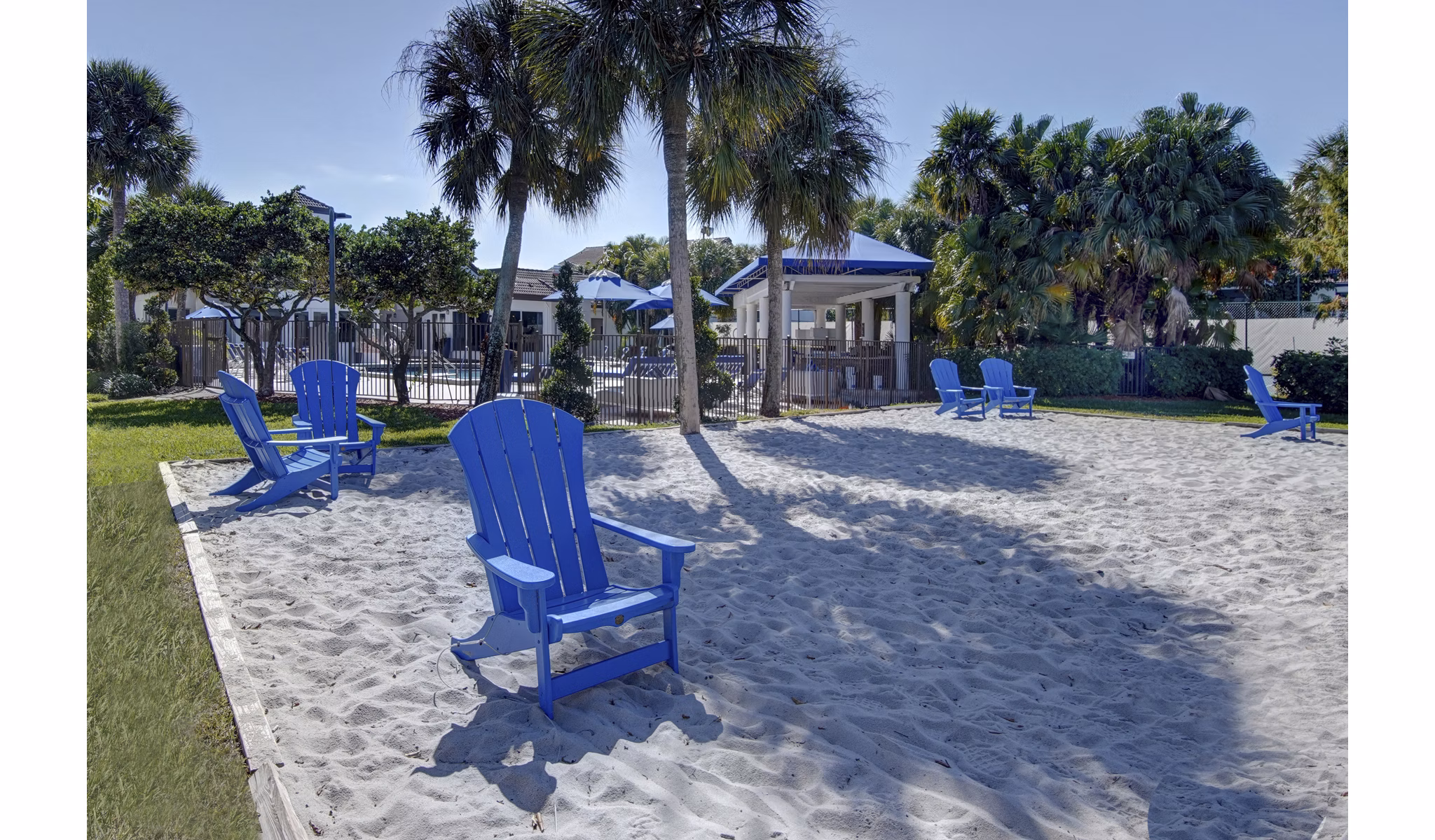 Sport court at La Morada at Weston Apartments featuring basketball hoops and tennis lines