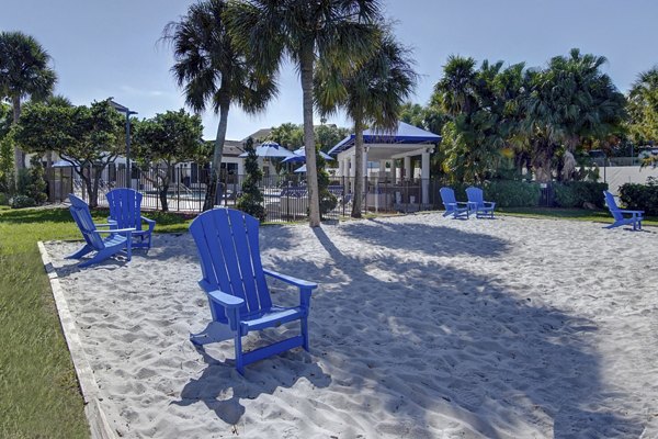 Sport court at La Morada at Weston Apartments featuring basketball hoops and tennis lines