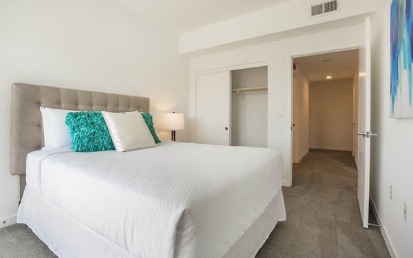 Cozy bedroom with natural light at ONYX Glendale Apartments