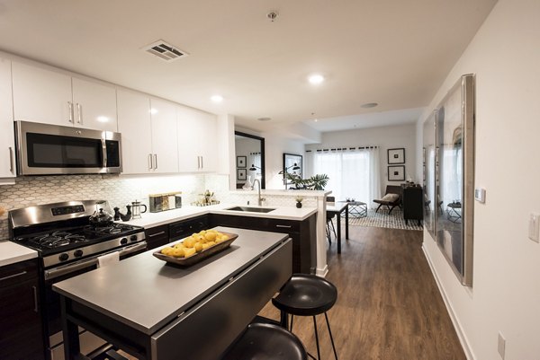 Modern kitchen with stainless steel appliances at ONYX Glendale Apartments