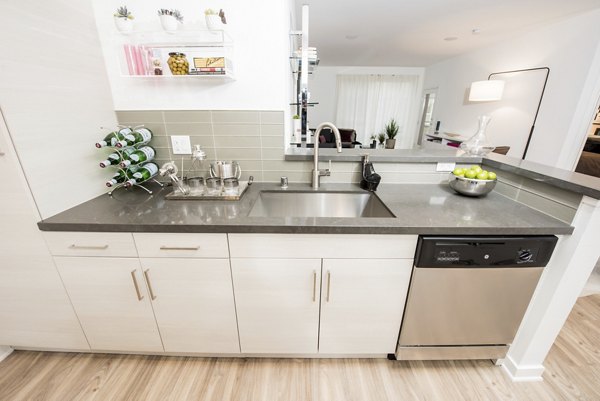Modern kitchen featuring stainless steel appliances at ONYX Glendale Apartments